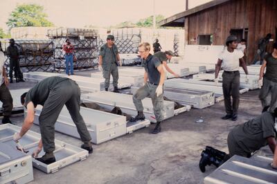 US military personnel arrived to repatriate bodies of the Americans who died at Jonestown, back to the US. Jones had told his followers that men were coming to 'torture' their children, and suicide was the only escape. Alamy