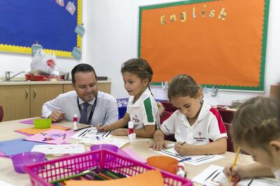 DUBAI, UNITED ARAB EMIRATES - SDEPTEMBER 2, 2018. 
Brendan Fulton, Principal at Dubai British School, interacts with year 1 students on their first day of school.

(Photo by Reem Mohammed/The National)

Reporter: Ramola TalwarSection:  NA