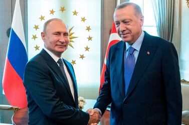 Russian President Vladimir Putin (L) and Turkey's President Recep Tayyip Erdogan shake hands during their meeting in Ankara on September 16, 2019. AFP