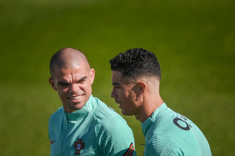 Cristiano Ronaldo and Pepe attend a training session at the Cidade do Futebol training ground. AFP