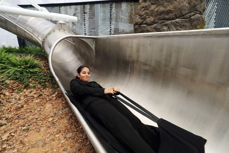 Shireen Shakeel rides the slide at the Luxembourg pavilion at Expo 2020.