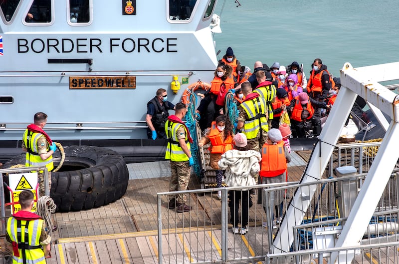 People disembarking at Dover Docks after British Border Force Officials intercepted two boats in the English Channel. EPA