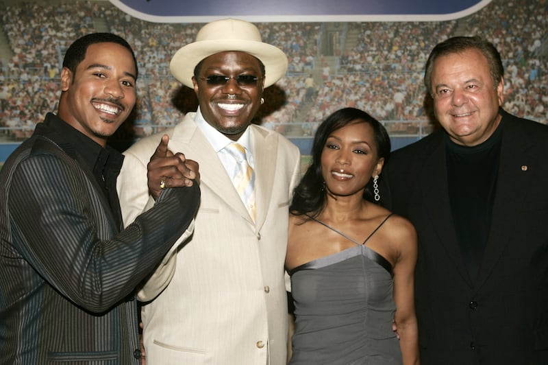 Brian White, Bernie Mac, Angela Bassett and Sorvino, attend the 'Mr 3000' premiere in Hollywood in September 2004. Reuters 