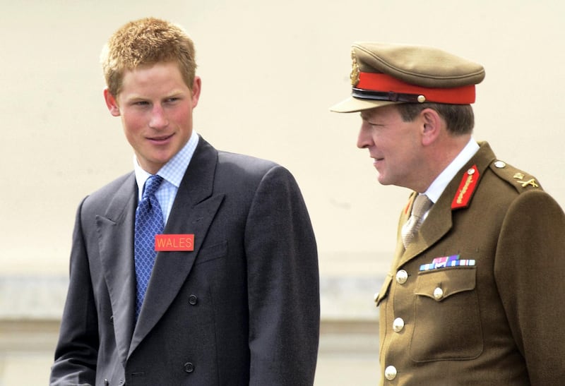 SANDHURST, ENGLAND -  MAY 8: HRH Prince Harry is met by Commandant Major General Andrew Ritchie accompanied by his father HRH The Prince of Wales (not in frame) at Sandhurst Royal Military Academy, Harry will now begin his officer training, on May 8, 2005 in Sandhurst, Surrey. Prince Harry, over the coming days, begins his military career with a 44-week commissioning course. For the first five weeks, he must stay on site all the time. His entry is delayed from January due to a knee injury. (Photo by Anwar Hussein/Getty Images)