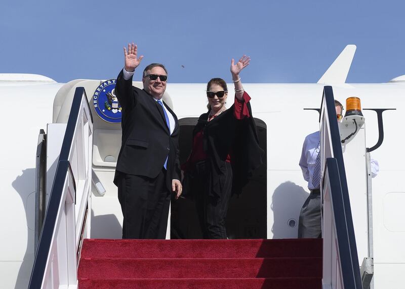 Mike Pompeo and his wife Susan depart from Abu Dhabi International Airport. AFP