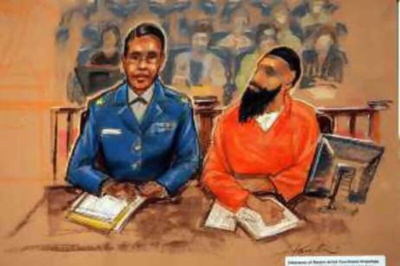 Binyam Mohammed, right, sits with his unidentified defence counsel in the US military courtroom in Guantanamo Bay, Cuba, in April in this sketch.