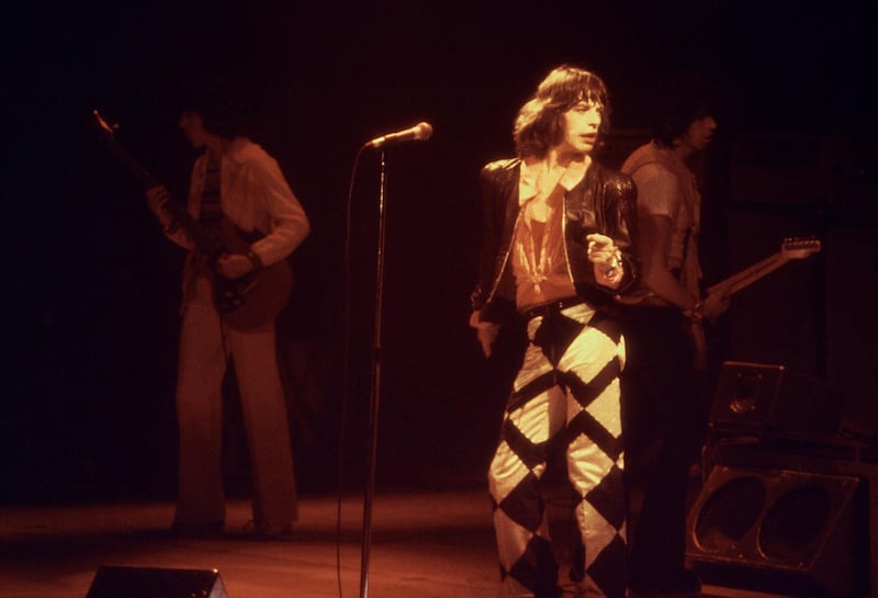 Mick Jagger, lead singer of the rock group the "Rolling Stones" performs with his band in Glasgow in May 1982.   (FILM) AFP PHOTO (Photo by PA / AFP)