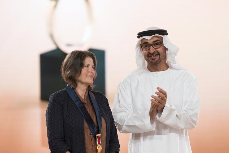 Sheikh Mohamed bin Zayed presents a 2015-2016 Abu Dhabi Award to Deborah Henley, who received the award on behalf of her late mother Susan Hillyard, at Emirates Palace. Ryan Carter / Crown Prince Court — Abu Dhabi
