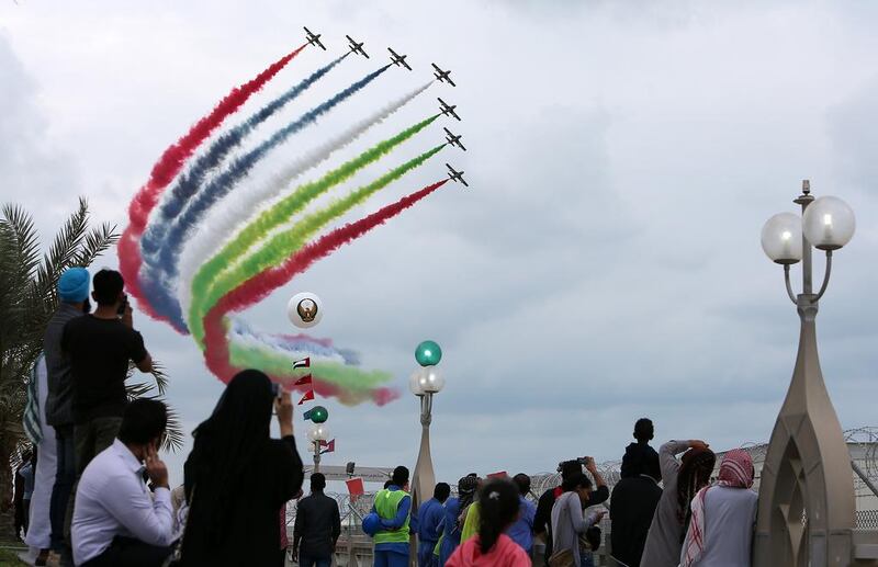 People watching the air show by UAE flying team Al Fursan. Pawan Singh / The National