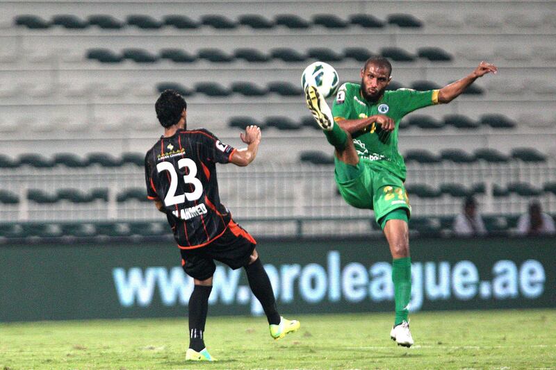 Dubai, United Arab Emirates, Nov 12, 2012 - Essa Obaid (right) from Al Shabab fight for the ball against  Waleed Ahmed Hassan from Ajman at Shabab's Maktoum Bin Rashid Al Maktoum Stadium. ( Jaime Puebla / The National Newspaper )