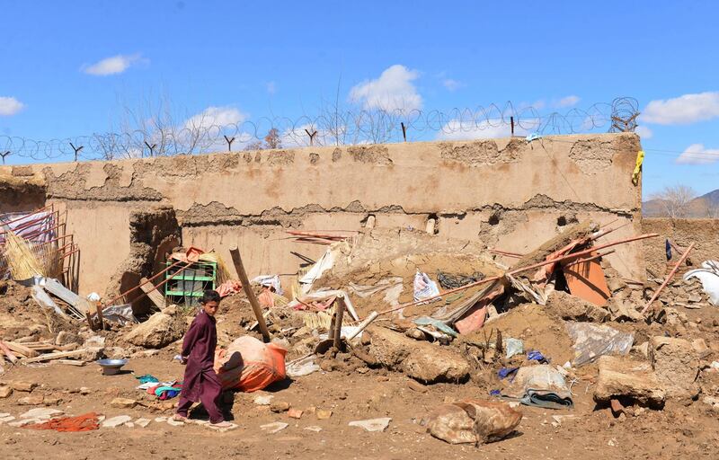 A boy walks inside what is left of a home that was damaged by heavy rains in Kandahar province, south of Kabul, Afghanistan, on March, 3, 2019. AP Photo