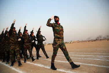 Members of the paramilitary Popular Mobilisation Forces attend their graduation ceremony at a military camp in Karbala, Iraq, on August 30, 2019. Reuters