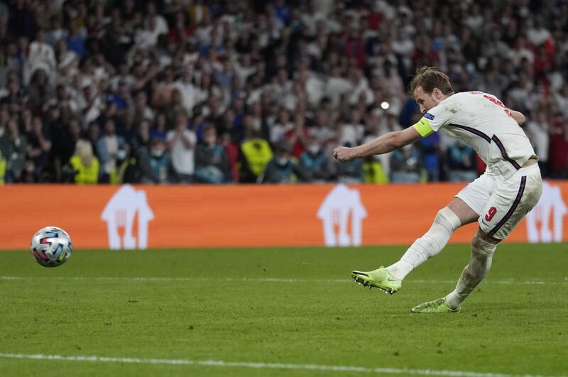 England's forward Harry Kane scores during the penalty shootout.