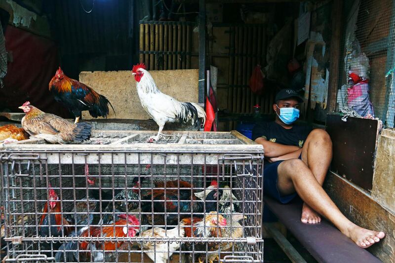 A vendor waits for customers at a traditional market in Jakarta, Indonesia. Reuters