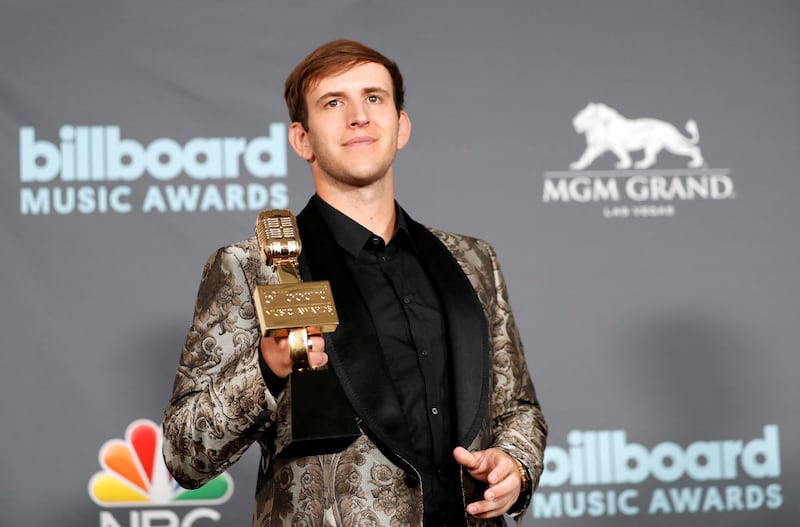 Illenium poses with award for Top Dance/Electric Album. Reuters