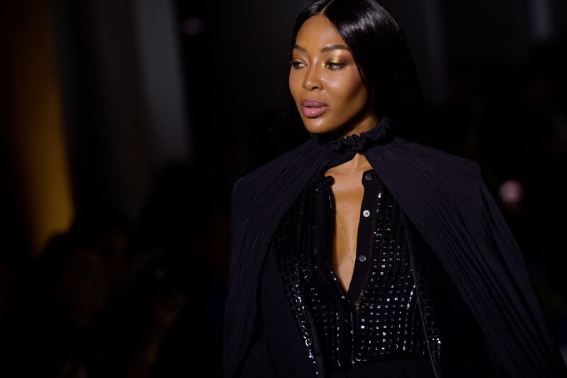 The piece de resistance was Naomi Campbell rounding off the show in a black superhero cape. AFP