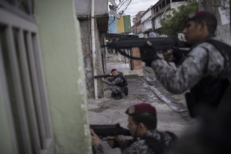 Brazil's national security force officers during a police operation in search of criminals in Mare favela, where a police officer was shot in the head on August 11, 2016 during the Rio Olympics. Felipe Dana / AP 
