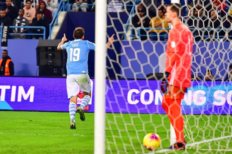 Lazio's Bosnian midfielder Senad Lulic (L) celebrates after scoring during the Supercoppa Italiana final. AFP