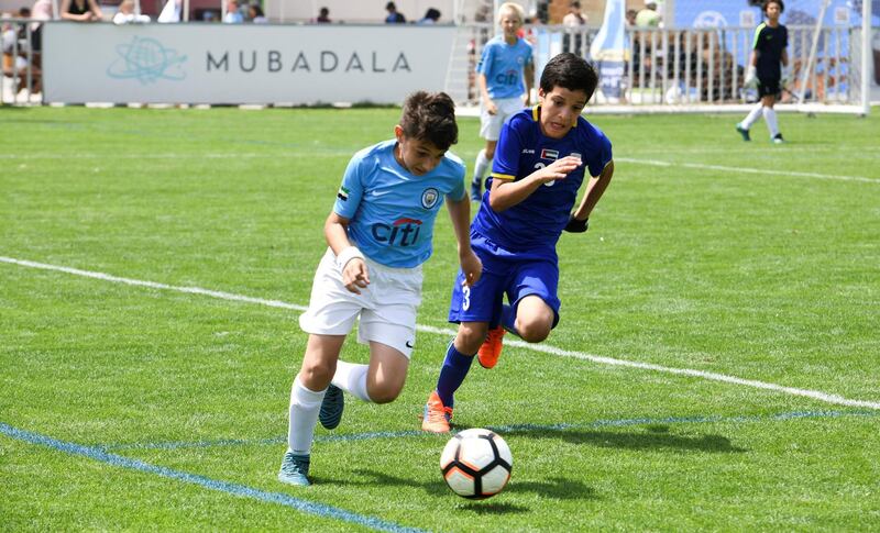 Abu Dhabi, United Arab Emirates - Abu Dhabi City (light blue) vs Al Dhafra (dark blue) on Abu Dhabi World Cup Day 1 at Zayed Sports City. Khushnum Bhandari for The National
