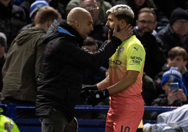Manchester City manager Pep Guardiola, left, and goalscorer Sergio Aguero during the FA Cup fifth-round tie at Sheffield Wednesday. EPA