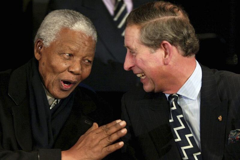 Britain’s Prince Charles shares a light moment with Nelson Mandela during a show at the Amsterdam arena in 2002. Robin Utrecht / Reuters
