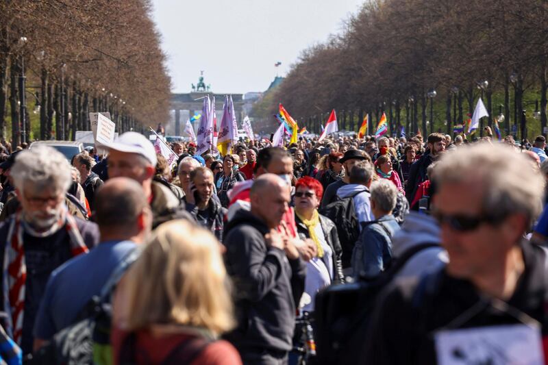 People take part in a protest against the government measures to curb the spread of the coronavirus disease, as the lower house of parliament Bundestag discusses additions for the Infection Protection Act, in Berlin, Germany. Reuters