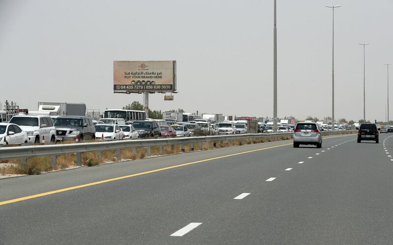 DUBAI, UNITED ARAB EMIRATES , July 15 – 2020 :- Traffic jam at the Dubai border going towards Abu Dhabi on Sheikh Zayed road in Dubai. (Pawan Singh / The National) For News/Online