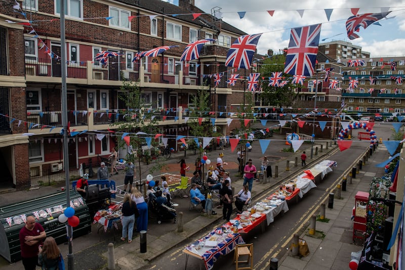 Residents of the Kirby estate in Bermondsey enjoy a party with a BBQ, drinks and a bouncy castle to celebrate the coronation. Getty Images