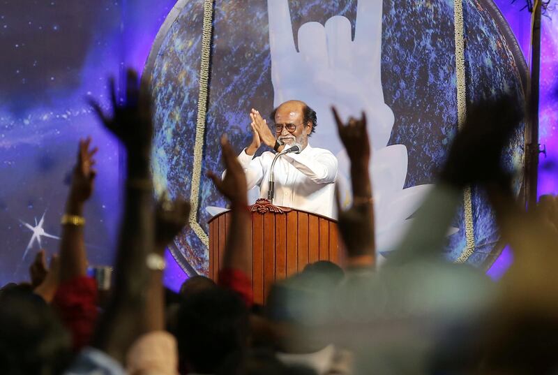 Actor Rajinikanth greets his supporters after announcing the launch of his political party. P. Ravikumar / Reuters