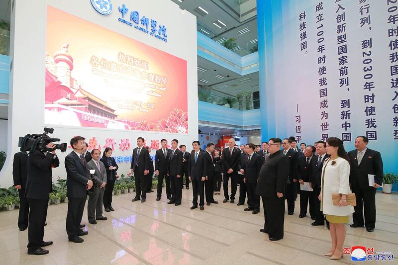 North Korean leader Kim Jong Un and his wife Ri Sol Ju visit the Chinese Academy of Sciences, as he paid an unofficial visit to China. KCNA / via Reuters