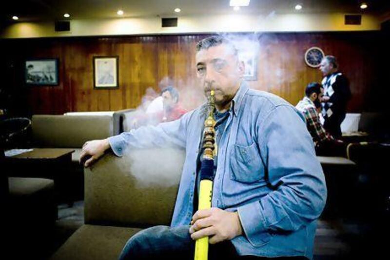 Ahmet Akkaya, who runs a snack kiosk in Instanbul, says shisha is part of an unhurried and sociable Turkish way of life. Kerem Uzel for The National