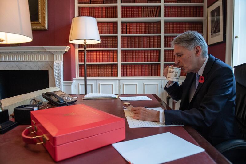 BESTPIX - LONDON, ENGLAND - OCTOBER 28:  Chancellor of the Exchequer, Philip Hammond, drinks tea as he prepares his speech in his office in Downing Street ahead of his 2018 budget announcement tomorrow, on October 28, 2018 in London, England. The Chancellor will deliver his last budget speech before the official Brexit date next year of March 29, 2019. (Photo by Chris J Ratcliffe - WPA Pool/Getty Images)