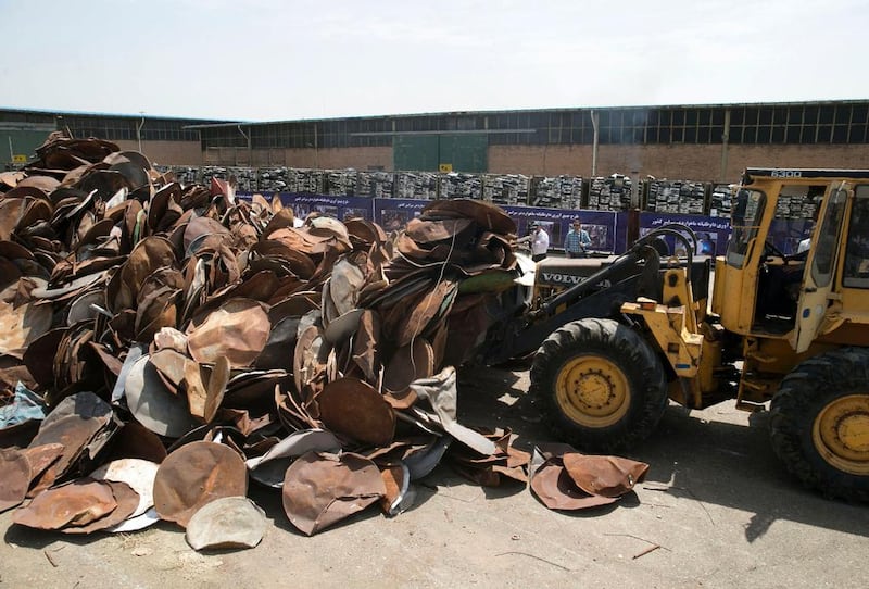 Satellite dishes and receivers are piled up before being destroyed in the Iranian capital, Tehran, on July 24, 2016. Hossein Zohrevand/Tasnim News/AFP  