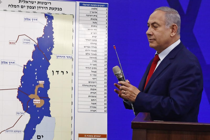 Benjamin Netanyahu, Israel's prime minister, shows a map of the Jordan Valley and West Bank settlements whilst speaking during an event in Tel Aviv, Israel, on Tuesday, Sept. 10, 2019. The prime minister has been playing up the precariousness of his position in an effort to persuade nationalists to vote for his Likud party. Photographer: Kobi Wolf/Bloomberg