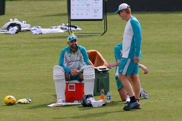 Australia's Nathan Lyon, left, chats with interim coach Andrew McDonald, right, during a practice session at the Pindi Stadium, in Rawalpindi, Pakistan, Wednesday, March 2, 2022.  Pakistan and Australia cricket teams will play first test match on March 4.  (AP Photo / Anjum Naveed)