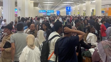Passengers gather at Dubai International Airport on Thursday as operations gradually resume following weather-related disruption. Reuters