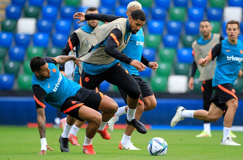 Ruben Loftus-Cheek is tackled during a training session at Windsor Park in Belfast.