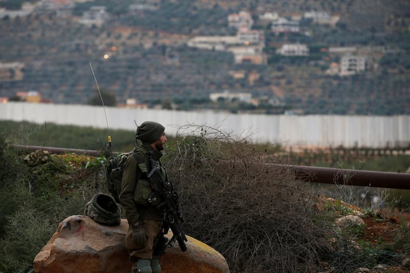 FILE PHOTO: An Israeli soldier guards near the border with Lebanon, the morning after the Israeli military said it had launched an operation to "expose and thwart" cross-border attack tunnels from Lebanon, in Israel's northernmost town Metula December 5, 2018. REUTERS/Ronen Zvulun/File Photo