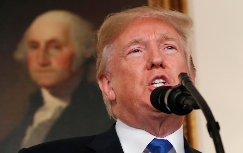 U.S. President Donald Trump speaks about Iran and the Iran nuclear deal in front of a portrait of President George Washington in the Diplomatic Room of the White House in Washington, U.S., October 13, 2017. REUTERS/Kevin Lamarque