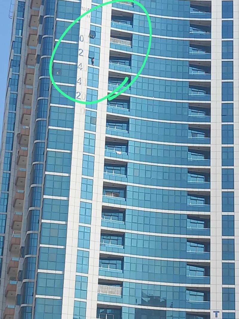 An image of Farouq Mohammad, 5, dangling from the window of the Sharjah residential tower he lives in. Photo: Supplied