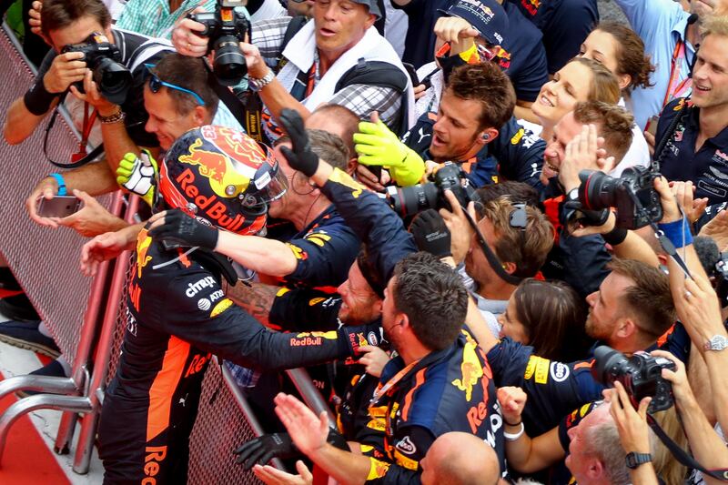 epa06237708 Dutch Formula One driver Max Verstappen of Red Bull Racing celebrates with team members after winning the Malaysian Formula One Grand Prix at the Sepang International Circuit, near Kuala Lumpur, Malaysia, 01 October 2017.  EPA/DIEGO AZUBEL