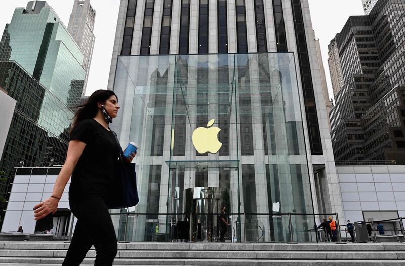 A person walks past the Apple store on Fifth Avenue on September 28, 2020 in New York City. Coronavirus infection rates have increased at "an alarming rate" in several New York neighborhoods, particularly among the Orthodox Jewish community in Brooklyn, city health authorities warned Sunday, threatening to sanction certain schools if they fail to comply with anti-virus regulations. / AFP / Angela Weiss
