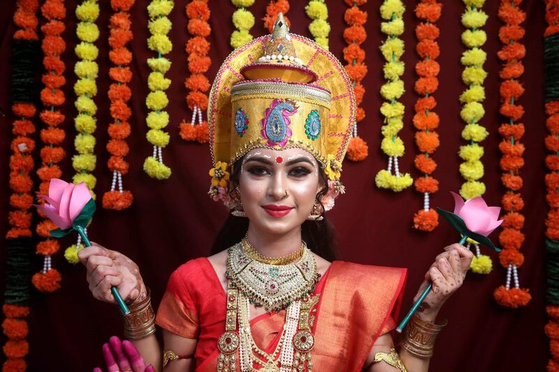 A woman dressed as Lakshmi, the Hindu goddess of wealth, in Bhopal, India. EPA