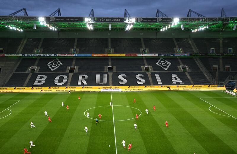 An overview shows the empty stadium during the German first division Bundesliga football match Borussia Moenchengladbach v 1 FC Cologne in Moenchengladbach, western Germany on March 11, 2020. - Rhine Bundesliga derby between Borussia Moenchengladbach and Cologne, will be held behind closed doors due to the coronavirus, the first game in Bundesliga history to be played without fans. (Photo by Ina FASSBENDER / AFP) / DFL REGULATIONS PROHIBIT ANY USE OF PHOTOGRAPHS AS IMAGE SEQUENCES AND/OR QUASI-VIDEO