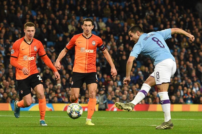 Manchester City midfielder Ilkay Gundogan scores the opening goal during the UEFA Champions League match against  Shakhtar Donetsk at the Etihad Stadium. AFP