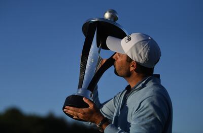 Charl Schwartzel poses with the trophy after winning the LIV Invitational Series at the Centurion Golf Club in St Albans, England, on June 11. EPA