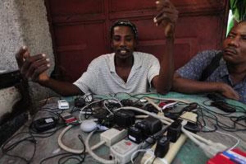 Jenni Chery, 36, has started a mobile-phone charging business in Port-au-Prince.