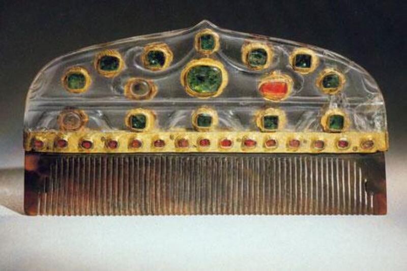 A comb from Turkey from the late 16th-17th century; rock crystal inlaid with gold and set with emeralds and rubies.