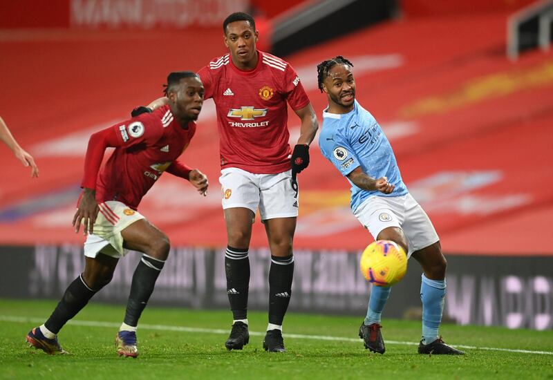 Manchester City's Raheem Sterling in action with Manchester United's Anthony Martial and Aaron Wan-Bissaka. Reuters