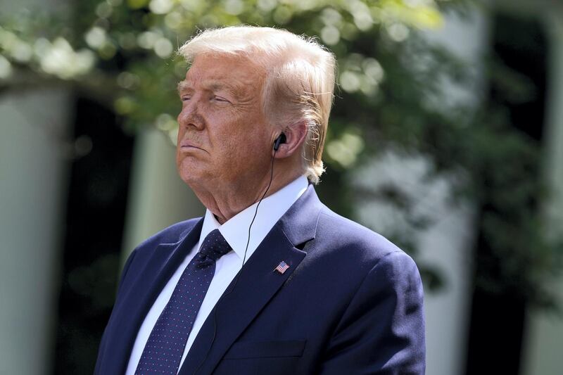 President Donald Trump listens as Mexican President Andres Manuel Lopez Obrador speaks during an event in the Rose Garden at the White House, Wednesday, July 8, 2020, in Washington. (AP Photo/Evan Vucci)